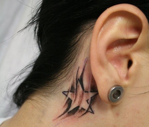 star tattoo with smoky shading behind the ear