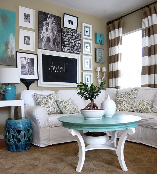 Living room with gallery wall, white sectional, and turquoise accents