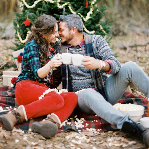 Holiday engagement couple in winter outdoor light