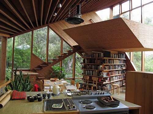 Wooden stair core wrapped in open bookshelves