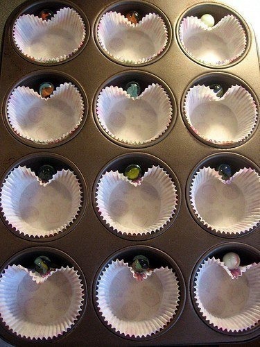 Heart-shaped cupcakes made with marbles in the tin