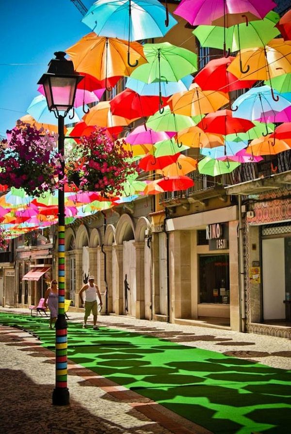 Dense colourful umbrellas over Portugal streetscape