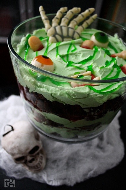 Green and chocolate swamp trifle with skeleton hand