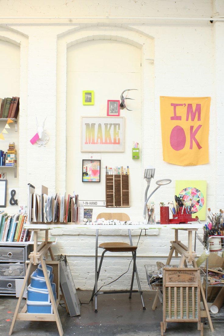 Craft room with tall shelving and worktable