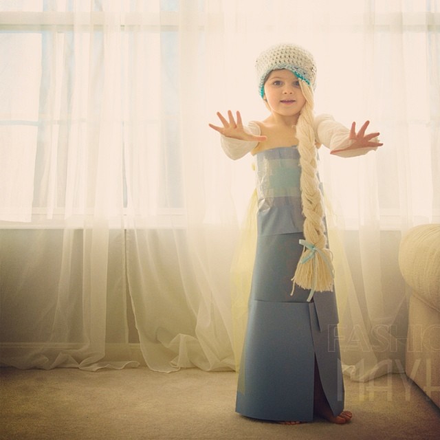 Little girl in stylish paper dress