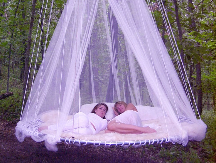 Round hanging floating bed with soft lighting