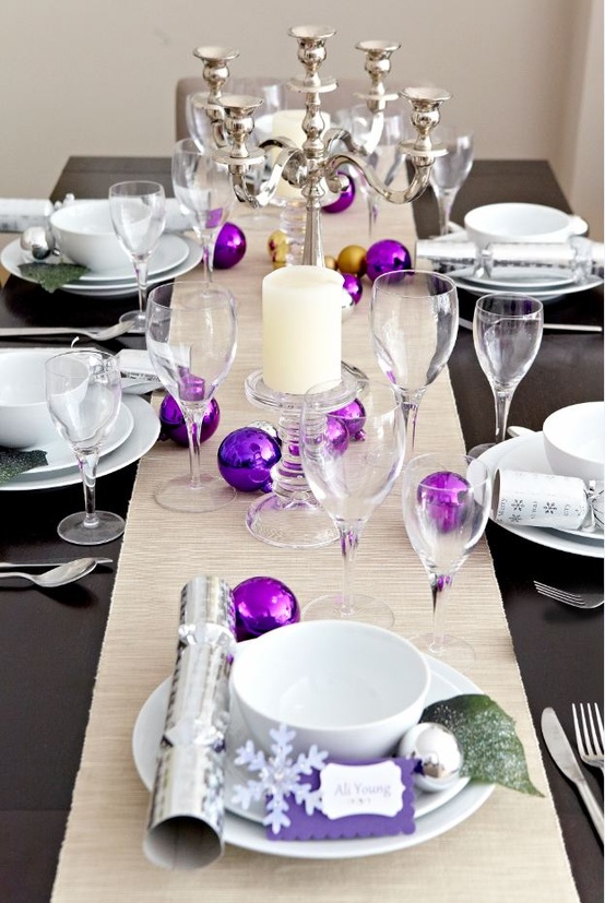 Purple and silver Christmas table with place cards and candelabra