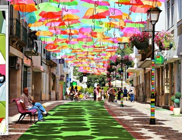 Umbrella canopy stretching along a town street