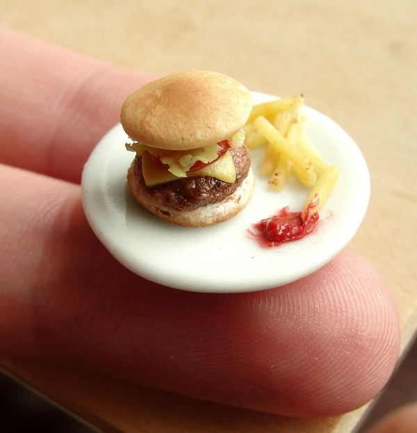 delicious-mini-foods13 Fingertip-sized cheeseburger and fries with ketchup on a white plate