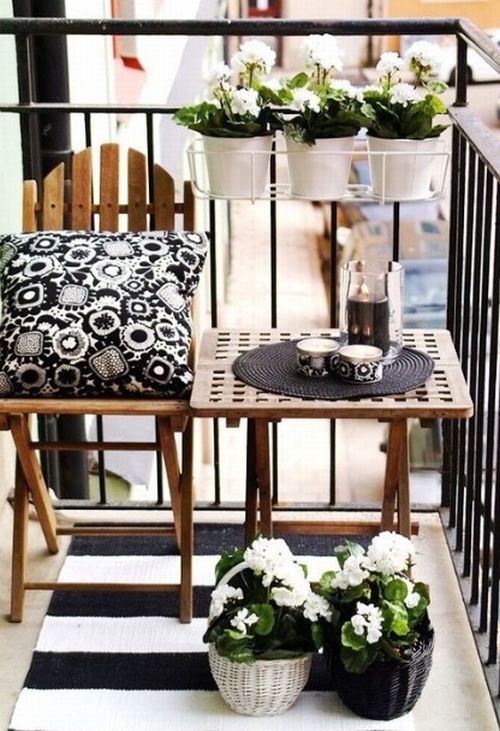 Compact balcony lounge chair and plants