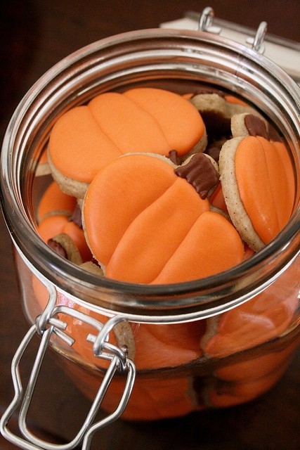 Jar of orange iced pumpkin cookies