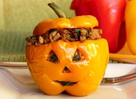 Jack-o-lantern stuffed orange bell pepper