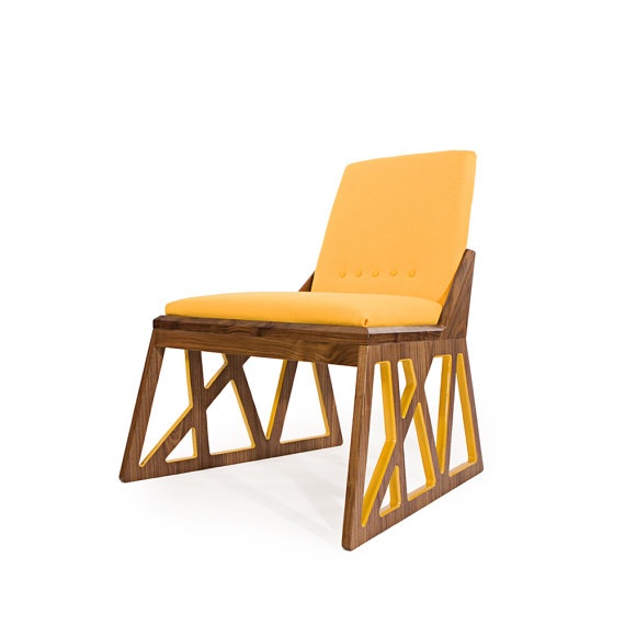 Yellow-cushioned lounge with geometric cutout wood sides