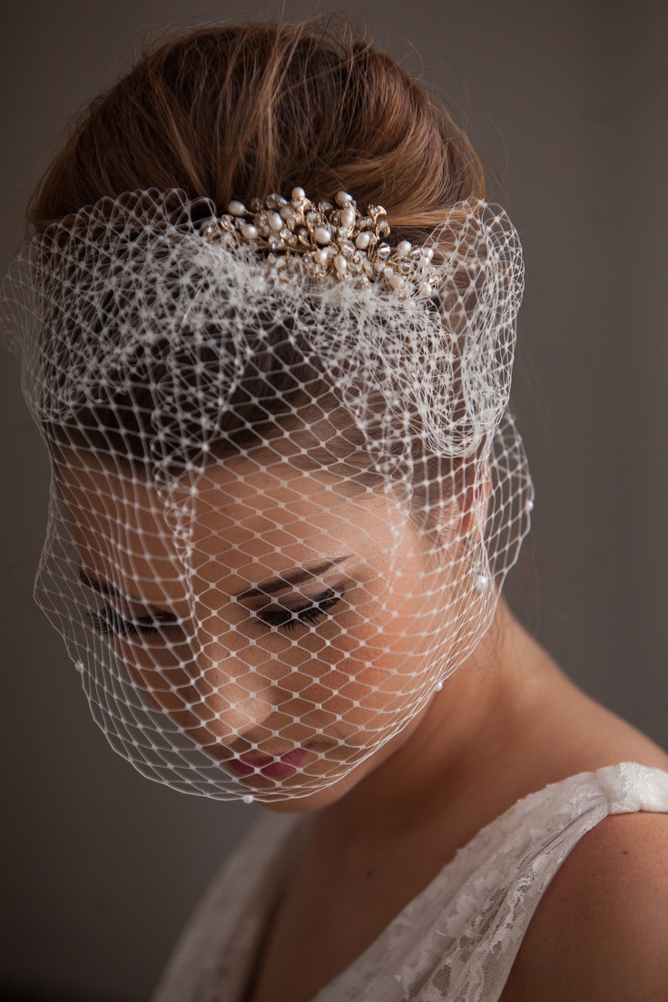 Birdcage veil paired with soft romantic waves