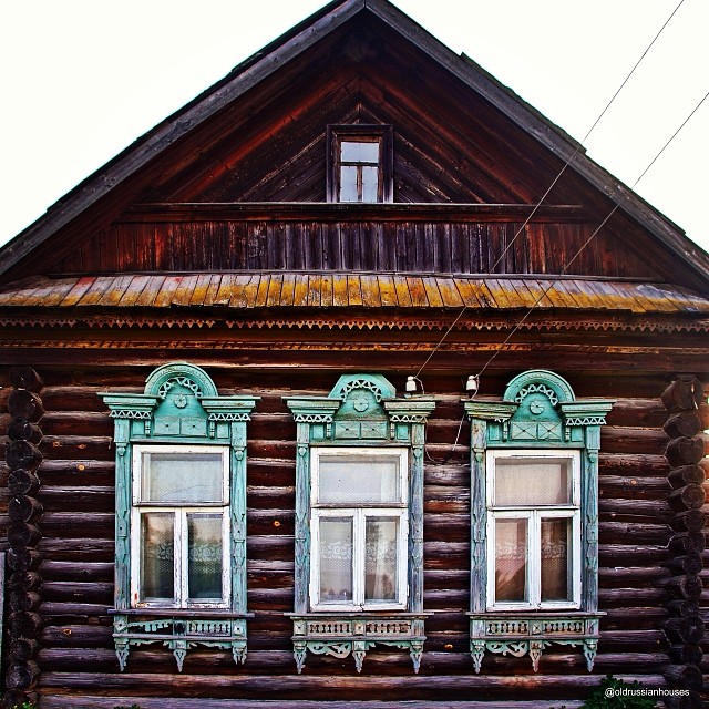 Weathered ornamental woodwork on a house front