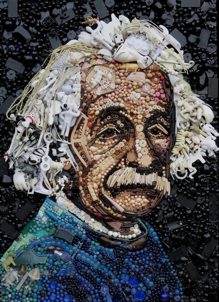 Close detail of found objects forming a painted surface