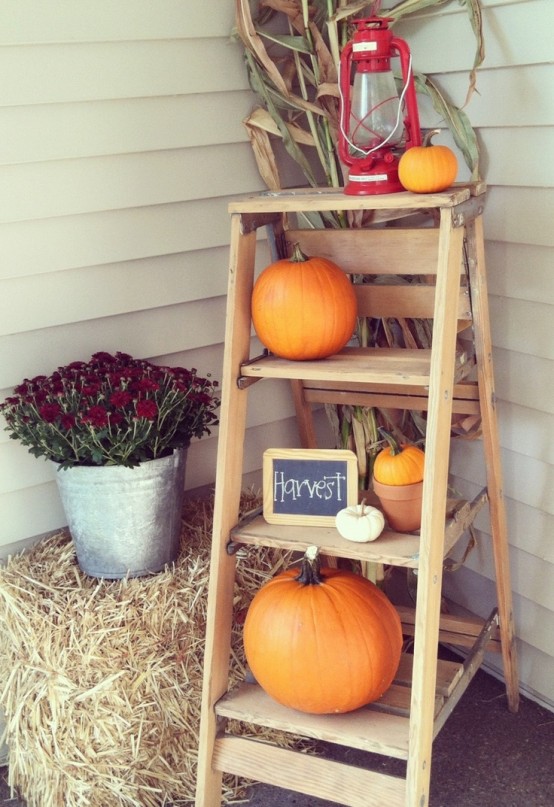 Autumn porch with mums and pumpkins