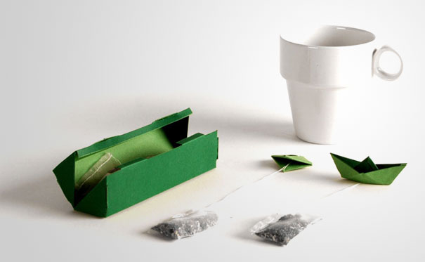 Green tea packaging with origami boat tea bag tags
