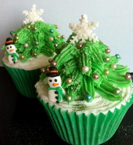 Decorated Christmas cupcakes on display