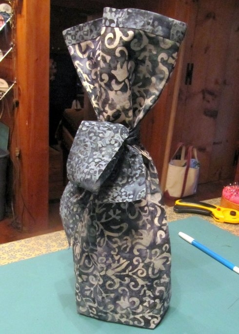 Wine bottle with ribbon and tag