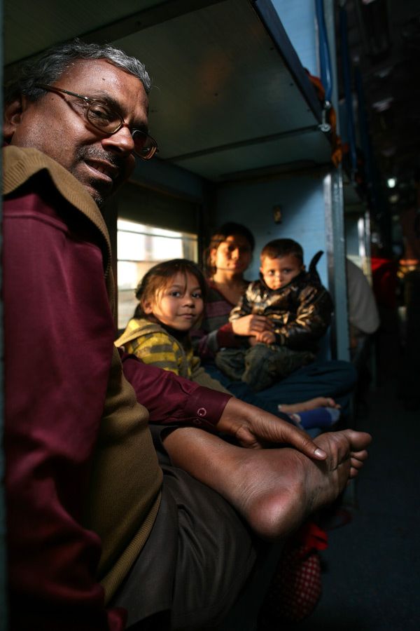Family seated in an Indian train compartment