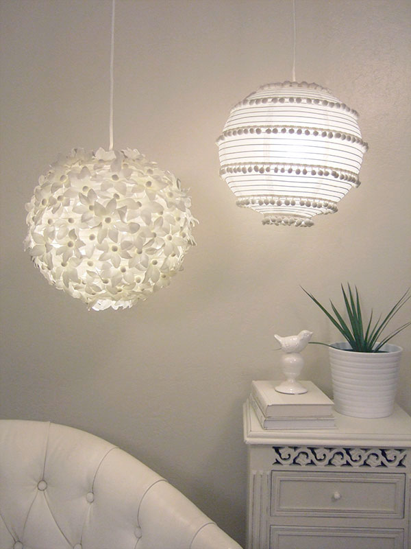 Paper lanterns decorated with flowers and pom-poms