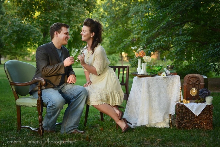 Engaged couple laughing outdoors