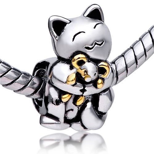 Metal charm with polished finish