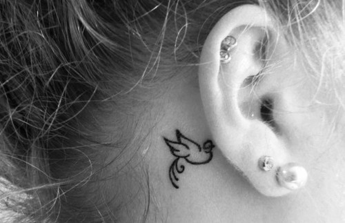 line art bird tattoo behind the ear