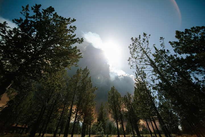 Wedding couple framed by wildfire light in Central Oregon
