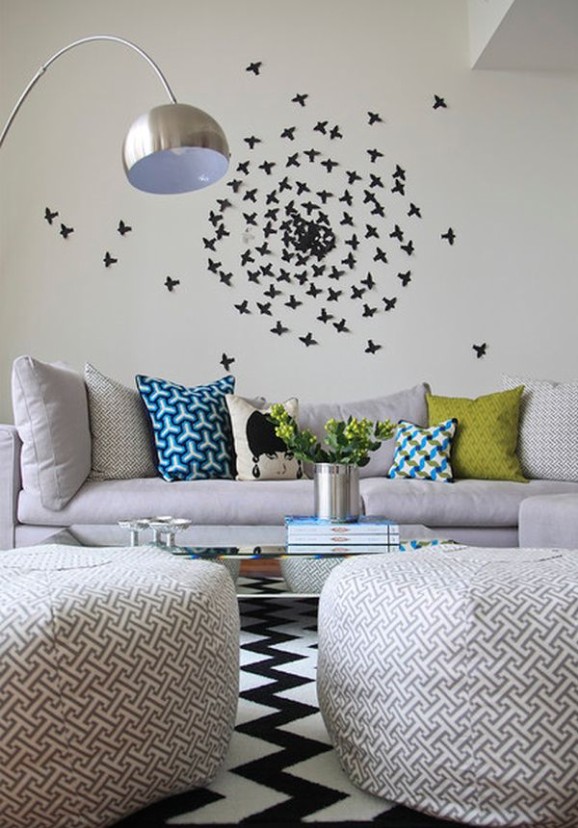 Living room with patterned pillows, chevron rug, and bird silhouette wall art