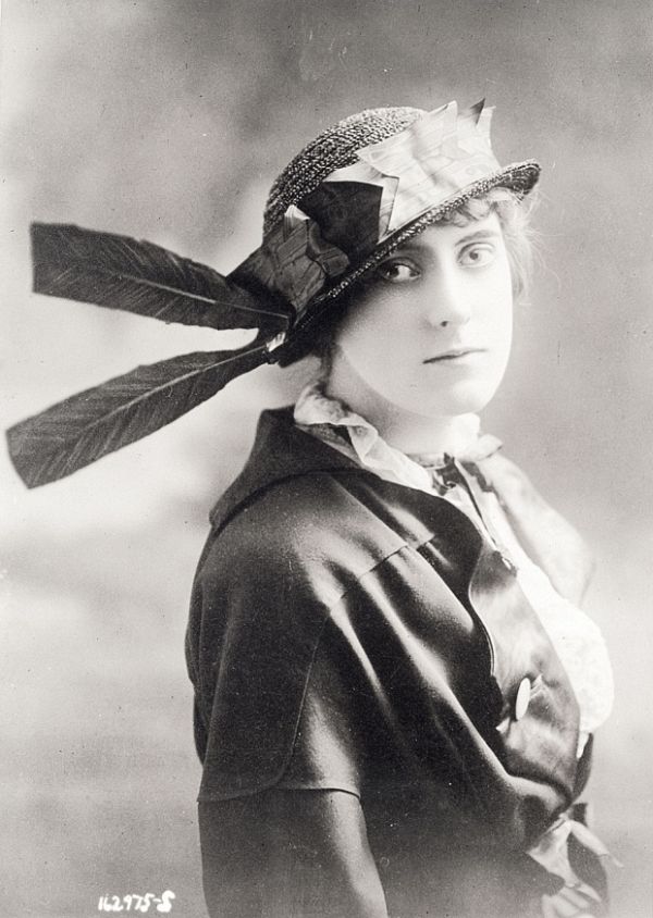 Historical photograph of a woman in a decorated 1910s hat