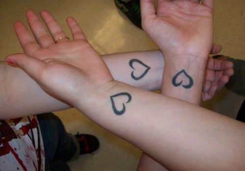 Creative sister tattoo pair