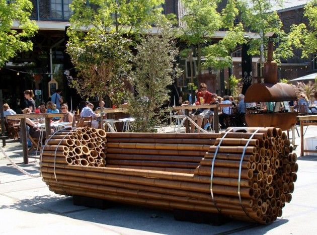 Garden bench with relaxed cushion arrangement