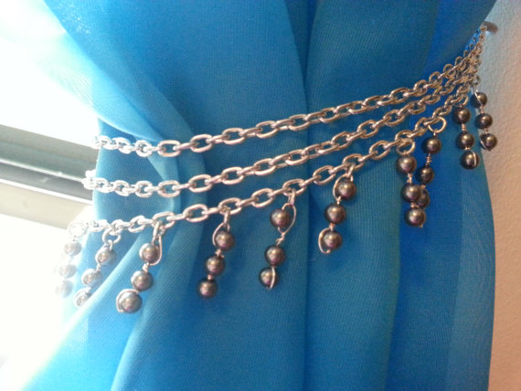 Window curtain styled with tieback