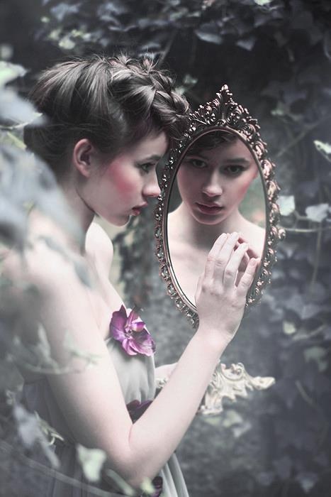 Woman and mirror in a moody portrait