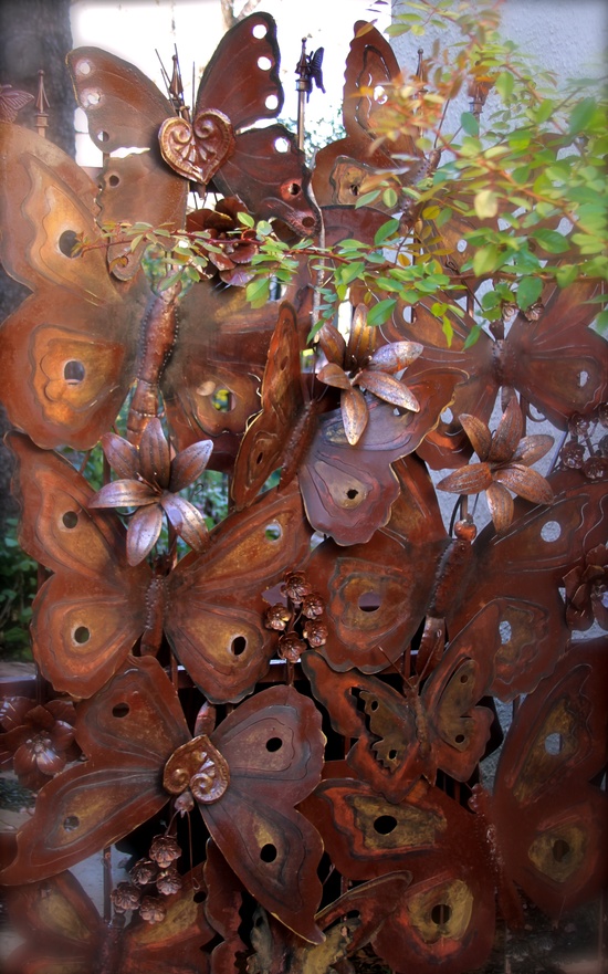 Iron garden gate with scrollwork