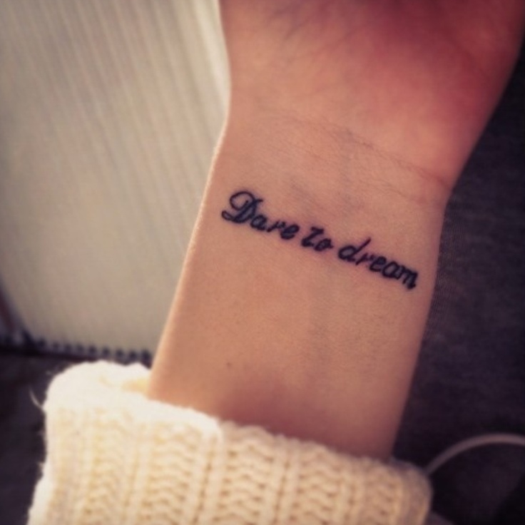 Small symbolic wrist tattoo example