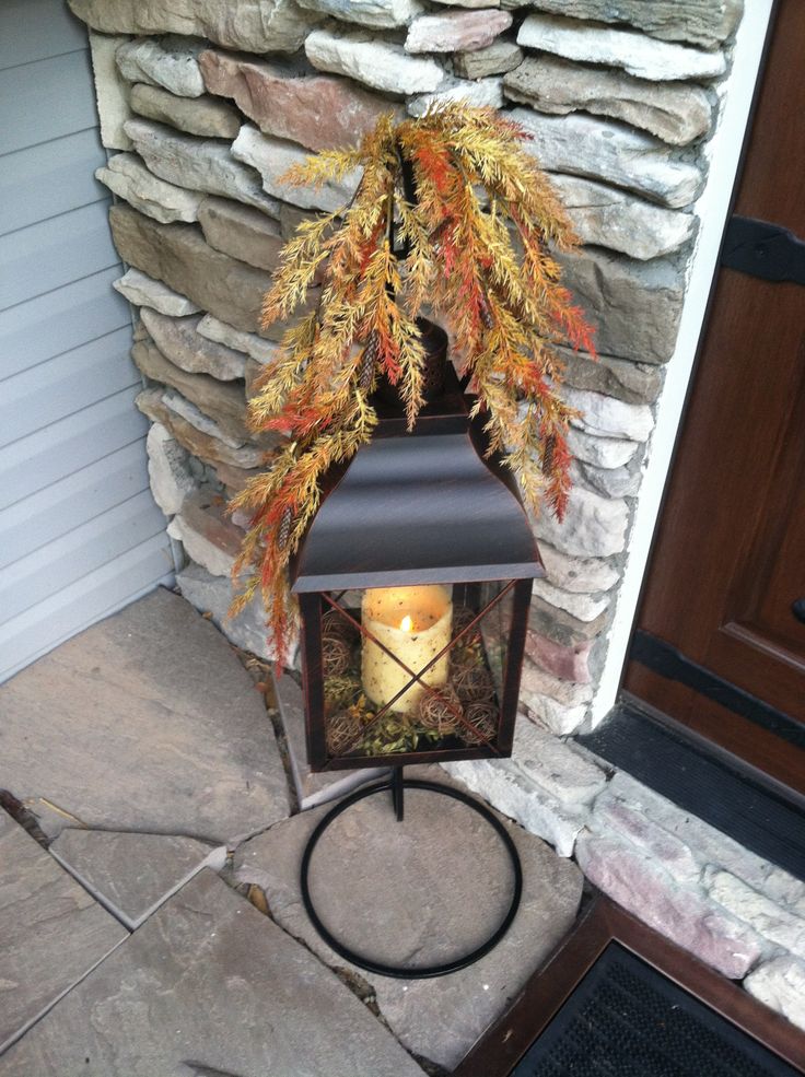 Mantel styled with autumn lanterns