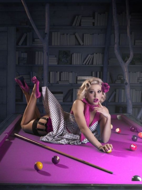 Classic pin-up pose adapted for boudoir portraiture