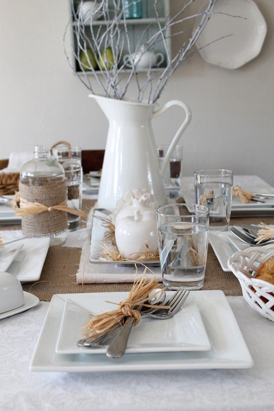 Soft white winter dining table arrangement